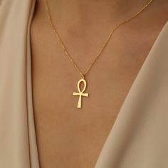 "🌟 Elevate your style with our stunning 14K Gold Ankh Necklace! This symbolic piece, inspired by the Egyptian Cross, is more than just jewelry--it's a representation of life and eternity. 💫 Handcrafted with care and precision, each necklace features a delicate chain for timeless elegance. ✨ Whether you're treating yourself or searching for the perfect gift, our Dainty Ankh Necklace is a must-have accessory.  🎁 Ideal for birthdays, Mother's Day, or as a thoughtful bridesmaid gift, this Egyptia Spiritual Ankh Cross Necklace Gift, Gold Ankh Necklace Gift, Gold Ankh Necklace For Gift, Gold Ankh Cross Necklace Gift, Spiritual Ankh Necklace For Gift, Egyptian Inspired Jewelry, Egyptian Cross, Key Of Life, Symbol Of Life