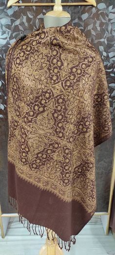 "🔷Vibrant Brown color 100% semi pashmina beautiful \"Jamavar\" Shawl/stole 80\"×28\" is fully fully embroidered by our talented and young artist. Jamavar means which is full covered/fill with embroidery. This shawl/shawl is embroidered by Golden color thread to make shawl/stole more attractive and beautiful.And the thread of this embroidery is silk thread. 🔷The Product is made of combination of wool and Pure Pashmina. 🔷The shawl/stole have beautiful handmade fringes too in the two end. 🔷This Festive Jamawar Pashmina Shawl For Winter, Traditional Patterned Pashmina Shawl, Traditional Pattern Pashmina Shawl, Winter Jamawar Pashmina Shawl Dupatta, Winter Jamawar Pashmina Shawl, Traditional Pashmina Shawl With Chikankari Embroidery, Winter Pashmina Dupatta With Traditional Patterns, Festive Pashmina Shawl Dupatta, Pashmina Shawl With Chikankari Embroidery