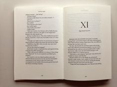 an open book with the letter x in it's center and two pages on each side