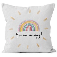 a pillow that says you are amazing with a rainbow in the middle and words on it