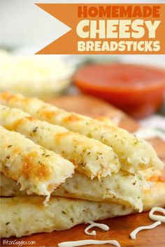 homemade cheesy breadsticks on a cutting board