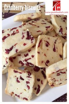 cranberry biscuits on a white plate with the words cranberry biscuit