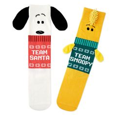 two socks with dogs on them and the words team santa written in red, white, and green