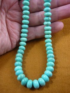 (Internal #V-326-16) You are bidding on a beautiful, handmade, necklace made with Chinese green/blue turquoise flattened round/rondell/donut beads 10x8 mm. Necklace is 16" long, with gold safety closure.* Want something longer, special order is $3.00 per inch.WE SHIP WORLDWIDE! Other accepted payment: Credit card (Mastercard/Visa/Discover) inquire for details. Turquoise Jewelry With Round Spacer Beads, Turquoise Jewelry With 8mm Round Beads, Turquoise Necklace With Round Beads, Green Turquoise Necklace With Polished Beads, Southwestern Round Turquoise Necklace, Turquoise Round Spacer Beads, Turquoise Spacer Beads Round Shape, Turquoise Spacer Beads, Ceramic Beads Necklace