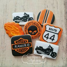 decorated cookies in the shape of motorcycles and road signs