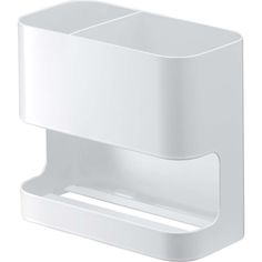 a white toilet paper holder with two compartments on the front and one in the back