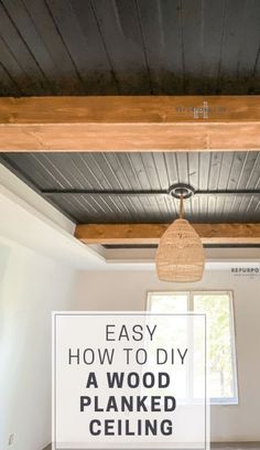 the ceiling in an empty room with text overlay that reads easy how to diy a wood planked ceiling