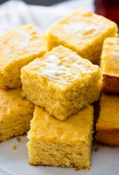 several pieces of cornbread on a white plate