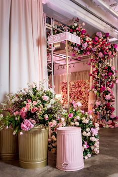 pink and gold flower arrangements are on display