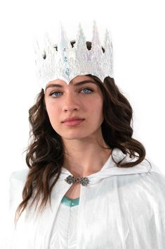 One Size Fits Most This soft white ice crown is made to last and is the perfect accessory for your ice queen costume. It has a hook and loop closure to ensure a perfect fit! You will be ready to rule your wintry kingdom in this iridescent crown that is adorned with glittering jewels to complete the look. Ice Crown, Ice Queen Costume, Soft Princess, Queen Crowns, White Crown, Fairest Of Them All, Halloween Headband, Queen Costume, Ice Princess