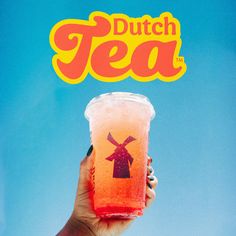 a person holding up a drink with the words dutch tea on it