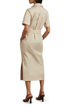 A drapey D-ring belt defines the waist of this polished shirtdress designed in a longline silhouette with abbreviated sleeves. Hidden-button half placket Spread collar Short sleeves Chest flap pockets; side-seam welt pockets Removable D-ring belt 74% cotton, 23% lyocell, 3% elastane Machine wash, line dry Imported Classic Belted Shirt Dress For Semi-formal Occasions, Knee-length Belted Shirt Dress For Semi-formal, Short Sleeve Midi Dress With Placket For Workwear, Formal Button-up Midi Dress With Tie Waist, Formal Knee-length Midi Dress With Placket, Workwear Shirt Dress With Spread Collar And Placket, Elegant Collared Midi Dress With Placket, Formal Collared Midi Dress With Placket, Elegant Belted Shirt Dress For Daywear