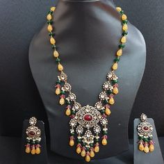 Yellow Green Kundan Polki Pendant Set With Earrings, Indian Jewelry, Bollywood Necklace, Sabyasachi Necklace, Statement Jewelry, Pakistani Jewelry The majestically handcrafted Kundan pendant set is the best to match Indian tradition and intricate work handcrafted by the artisans of India. The Kundan set is a masterpiece inspired by Sabyasachi jewelry to give you a royal look. The bold and bright design of the necklace is perfect for all the beautiful women * Necklace Length: 22 inches  (comes with adjustable dori) * Earrings Length: 2.25 inches approx * Material: Brass and stone * Package: Pendant set, and earrings STYLE TIP: This piece of elegant jewelry goes well with all your modern as well as traditional outfits. Best match for your wedding outfits ABOUT US: Jaipri makes each piece of Traditional Yellow Jewelry With Intricate Design, Traditional Yellow Cutdana Jewelry, Traditional Yellow Necklace With Intricate Design, Festive Fusion Bridal Necklace With Latkans, Traditional Yellow Ceremonial Jewelry, Fusion Style Chandbali Bridal Necklace For Festivals, Fusion Style Bridal Necklace With Latkans For Festivals, Festival Fusion Bridal Necklace With Latkans, Traditional Yellow Jewelry Sets For Festive Occasions