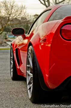 the rear end of a red sports car