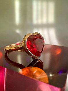 With its playful, symbolic vibe and juicy red color, this striking ring from our Simplicity Collection is a perfect addition to any modern collection. Large red heart shaped ruby is encased in meticulously hand finished band. This stunning ring will make a fun alternative to a traditional cocktail ring. Available for immediate shipping: Ruby 11mm x 12mm Set in 9K rose gold Size: 17.5 Please contact us for sizing options Luxury Red Heart Ring For Valentine's Day, Red Heart Cut Fine Jewelry Rings, Luxury Red Heart Ring, Luxury Heart Cut Ruby Ring, Ruby Heart Ring For Valentine's Day, Valentine's Day Ruby Heart Ring In Fine Jewelry Style, Luxury Red Heart Ring As Gift, Valentine's Day Ruby Heart Ring Fine Jewelry, Luxury Red Heart Ring Gift