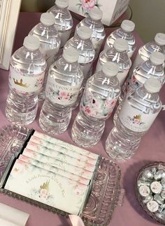 there are many water bottles on the table