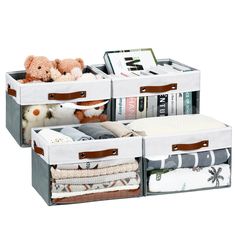 three storage bins with stuffed animals and blankets in them on top of each other