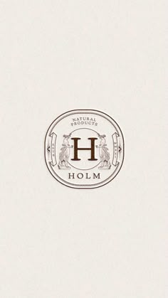 the logo for holm is shown in brown and white colors on a beige background