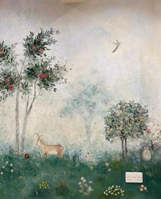 a painting on the side of a wall with trees and animals in it, surrounded by flowers