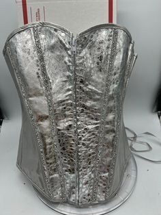 Custom Silver Bustier Corset With Diamond Rhinestone Embellishments. These are available in sizes small through 2XL. Silver is all the rage and this is a show stopper. Glamorous Party Corset With Rhinestones, Glamorous Fitted Corset With Rhinestones, Elegant Fitted Corset With Rhinestones, Fitted Rhinestones Corset, Glamorous Embellished Wedding Corset, Elegant Festival Corset, Silver Bustier, Silver Corset, Rhinestone Embellishments