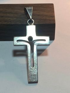 "This is a beautiful, vintage, genuine, handmade Taxco sterling silver cross pendant with a cutout of Jesus on the cross. The cross measures about 2 1/2\" by 1 1/8\" (about 2\" in length without its bale). The bale opening is about 5/8\". Very unique and well-made. The pendant weighs about 10.2 grams and is stamped TB-48 Mexico 925, which is the registration number and hallmark for the Taxco artisan who handmade the piece. It also has been tested and is sterling silver. Very striking and well-made. See pictures for details. More gorgeous jewelry here, and some on BIG clearance in my shop:  https://bargainbitz.etsy.com" Sterling Silver Cross Charms For Anniversary, Sterling Silver Cross For Anniversary, Sterling Silver Cross Jewelry For Anniversary, Silver Crucifix Cross Necklace For Anniversary, Stamped 925 Cross Necklace For Gift, Silver Stamped 925 Cross Necklace For Gift, Mexican Vintage, Christian Christmas Gift, Sterling Silver Cross Pendant