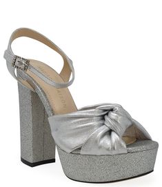 The Madison Maison Marilu Silver Glitter Platform Heel is a stylish and sophisticated shoe, crafted with a durable yet lightweight sole and a shimmering black glitter finish. Perfect for a night out or to add a touch of glamour to a more formal look. Glamorous Glitter Sandals For Formal Occasions, Glamorous Glitter Sandals For Gala, Metallic Round Toe Heels For Gala, Silver Glitter Sandals For Party Season, Glitter Closed Toe Sandals For Evening, Silver Glitter Sandals For Gala, Synthetic Sandals For Party And Holiday, Holiday Party Synthetic Sandals, Evening Sandals With Glitter Accents And Round Toe