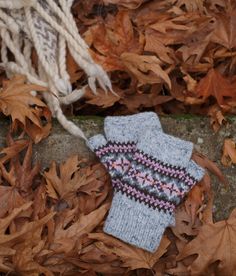 These mittens are hand knitted in 100%  wool using traditional Fair Isle Pattern. Fingerless mittens are knitted by me with a beautiful fair isle design These mittens  will keep your hands very warm, with the add benefit of keeping your fingers free. Designed to fit the average adult hand. Length: 19 cm / 17,5 inches Width: 10 cm / 4 inches Wash and care instructions: Cool hand wash with mild detergent. Do not tumble dry. Dry flat. Scandinavian Winter Handmade Knitting Pattern, Multicolor Hand Knitted Nordic Pattern, Nordic Multicolor Hand Knitted Patterns, Nordic Hand Knitted Winter Knitting Pattern, Nordic Style Hand Knitted Winter Knitting Pattern, Nordic Winter Hand Knitted Pattern, Nordic Winter Knitting Pattern, Hand Knitted Scandinavian Patterns For Winter, Scandinavian Hand Knitted Winter Knitting Pattern