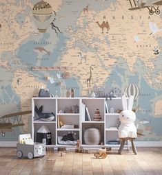 a child's room with a world map on the wall and toys all around it