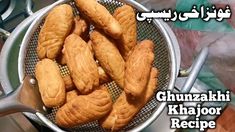 some kind of food in a strainer on top of a table with the words ghunazhi khajodor recipe