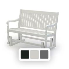 a white bench with four different colors on the top and bottom, in front of it