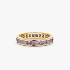 Adorn your finger with our Amethyst Eternity Ring, a radiant celebration of February's birthstone. This exquisite piece showcases the warm allure of the purple gemstone in a princess cut, offering a perfect blend of sophistication and individuality. Elevate your style with this timeless and vibrant symbol of elegance. Radiant Eternity Ring, Blue Stone Wedding Band, Blue And Gold Ring, Amethyst Wedding Band, Minimalistic Jewelry, Light Blue Sapphire, Amethyst Wedding, December Birthstone Ring, Eternity Rings