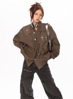 This stylish bomber jacket comes with shoulder patches, cross embellishments, and an asymmetric button up. Instantly elevate any look with this versatile and fashionable piece. Model is 5'4 115lbs wearing L Camo Jeans, Star Cross, Blue Vests, Oversized Denim Jacket, Oversized Jacket, Fitted Trousers, Relaxed Fit Jeans, Blue Skirt, Cargo Jeans