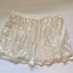 Nwot. No Visible Flaws. Lined. Rear Elastic Band. Selling As Is. Size Medium. Waistband Is Approximately 15” Across Laid Flat. Total Length From Band To Hem Is 14”. White Flowy Skirt Bottoms, Twirl Skirt, Sequin Mini, Cream White, Elastic Band, Hollister, Sequin, Womens Skirt, Size Medium