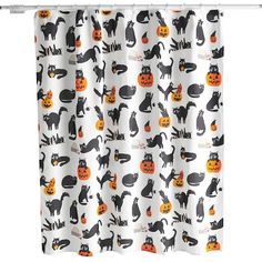 a shower curtain with cats and pumpkins on it