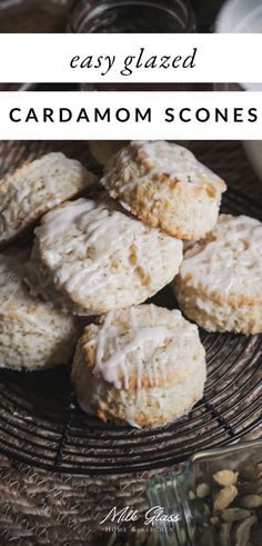 homemade easy glazed cardamoms with white icing on a wicker plate and text overlay that reads easy glazed cardamom scones