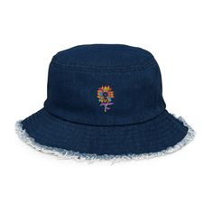 This denim bucket hat with a distressed brim and sunflower design is about as pretty as they come! Made with the comfort of 100% cotton, this hat not only shields you from the sun, but also creates a trendy fashion statement. You are sure to get lots of compliments!   * 100% cotton * Denim look * Classic brim with distressed look * 4 sewn eyelets on the sides of the hat * 2-panel design This product is made especially for you as soon as you place an order, which is why it takes us a bit longer to deliver it to you. Making products on demand instead of in bulk helps reduce overproduction, so thank you for making thoughtful purchasing decisions! Brimmed Denim Sun Hat For The Beach, Denim Bucket Hat For The Beach, Denim Wide Brim Bucket Hat For Beach, Wide Brim Denim Bucket Hat For Beach, Wide Brim Denim Bucket Hat For The Beach, Denim Bucket Hat For Beach, Adjustable Denim Sun Hat For Summer, Casual Sun Hat For Festivals, Flower Bucket Hat