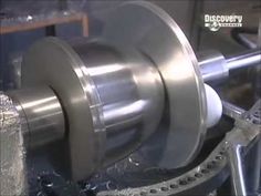 a machine that is working on some metal parts