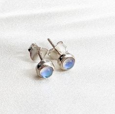 Mystic quartz stud earrings. Set in sterling silver, these are super verstile. They stand alone but also work well as a second or third lobe piercing stud to curate your look. Also available in gold vermeil. Shop our full earring collection at: https://tanviblue.etsy.com?section_id=49237495 Minimalist Silver Earrings With Bezel Setting, Tiny Round Sterling Silver Earrings, Minimalist Sterling Silver Earrings With Bezel Setting, Minimalist Sterling Silver Earrings With Round Stone, Dainty Silver Moonstone Earrings, Silver Minimalist Birthstone Earrings, Silver Moonstone Birthstone Earrings, Silver Moonstone Earrings With Birthstone, Silver Birthstone Earrings With Moonstone