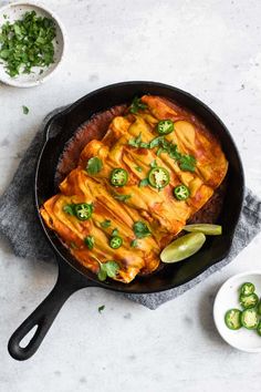 a pan filled with food sitting on top of a table