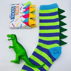 🦖 How fun are these novelty Dinosaur unisex socks, with felt spikes?  Be a big kid on your own or join in with your child and enjoy twinning it with matching socks ... (Also available in younger children's sizes) https://www.etsy.com/uk/listing/1006641052/kids-dinosaur-socks-kids-personalised You'll have hours of fun wearing these fab colourful socks and you'll definitely stand out in the crowd. 🦖 A fun idea for all your bachelors at your wedding or for a quirky and fun gift for that someone special. Socks will come packaged in a cool card design, if you'd like your packaging personalised then please check out my personalised sock listing.   Please note that sizes are in UK size 6-11  *Please note: Socks may vary slightly to the colours in the photos. This will either be a slightly diffe Adult Dinosaur Slippers, Cute Dino Socks, Playful Cheap Socks For Playtime, Wacky Socks For Boys, Funky Kids Xmas Socks, Stocking Fillers For Adults Uk, Socks Dinosaur, Mens Colorful Socks, Dinosaur Socks