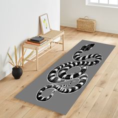 a black and white snake is on the floor