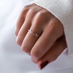 This minimalistic ring is the perfect accessory for stacking or on its own. Inspired by the ocean with its wave shape, this dainty ring is subtle, yet beautiful. Product Details - * Made from 925 sterling silver * Finish - 925 sterling silver * Multiple ring sizes  * This ring is not adjustable Not sure what your ring size is? A great way to work out your ring size is to find a ring that currently fits you and measure the diameter of the inside of the ring. This ring comes in XS, S, M, L, XL... XS - Diameter: 1.5cm/UK Size: J/US Size: 5/EU Size: 50 S - Diameter: 1.6cm/UK Size: L/US Size: 6/EU Size: 51.5 M - Diameter: 1.7cm/UK Size: N/US Size: 7/EU Size: 54 L - Diameter: 1.8cm/UK Size: P/US Size: 8/EU Size: 56 XL - Diameter: 1.9cm/UK Size: R/US Size: 9/EU Size: 59.5 Packaging - Your purchas Minimalistic Ring, Multiple Rings, Wave Ring, By The Ocean, Ocean Inspired, Nalu, Silver Prices, Making Waves, Ring Dainty