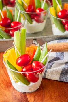 small glass bowls filled with vegetables and dip