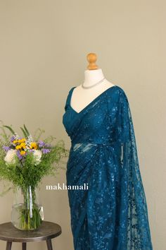 Beautiful teal blue saree in net thread embroidery. Finished with satin Patti finishing. Makes great pleat and easy to wear. Includes stitched blouse in plain raw silk, full sleeves. Size Guide: UK       8       10    12 usa      4       8      10 Euro    34     36    38 Please Dm for any for more informations. Blue Sequin Saree, Teal Blue Saree, Sequin Saree, Net Saree, Blue Saree, Thread Embroidery, Aqua Color, Deep Teal, Full Sleeves