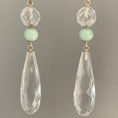 A fabulous original pair of Art Deco, 9ct Gold, Rock crystal & Jade, long drop earrings c1930s The earrings hang resplendently from the earlobes, pendulum like in their movement, the Rock crystal Quartz are briolette cut, a round section at the top, with a smaller mottled Jade bead set below, chain linked making them fully articulated. The large teardrop rock crystal section in suspended below like a drop of water, each facet reflecting the light beautifully. The earrings are stunning and generously sized yet due to the clear Rock crystal they have a light and ethereal appeal They are on 9ct Gold hook fittings for pierced ears which are likely to be replacements from the original screwback fittings Weight: 16.1 grams combined Dimensions: 5.8cm long x 11.2mm at the widest point Condition: E Vintage Drop Earrings With Matching Set, Vintage Drop Jewelry Set With Matching Earrings, Vintage Drop Earrings For Pierced Ears, Classic Chandelier Dangle Earrings With 17 Jewels, Vintage Formal Drop Earrings, Formal Vintage Drop Earrings, Faceted Long Drop Earrings For Anniversary, Classic Faceted Drop Jewelry, Classic Faceted Dangle Earrings