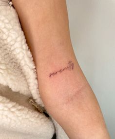 a woman's arm with a small tattoo on it that says, don't