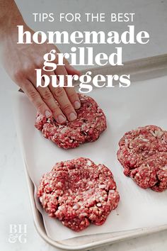 a person is placing ground meat on top of hamburger patties in a baking pan