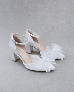 "Classic satin pointy toe heels topped with white organza bow on vamp and ankle strap for sweeter and romantic look. Perfect for brides, bridesmaids, wedding party, or evening wear. DETAILS: HEEL HEIGHT: 3 inches COLORS AVAILABLE: Ivory, White, Light Blue, Dusty Pink, Champagne, Burgundy, Navy and Black UPPER: Synthetic upper and lining MATERIALS: Manmade outsole STYLE NAME: SALLY Not sure of which size to purchase? Shoes measurements are as follow: (Please note measurements taken the length of Wedding Shoes With Bow And Block Heel, Bridesmaid Wedding Shoes With Satin Bow And Block Heel, Spring Wedding Shoes With Stacked Heel, White Satin Bow Wedding Shoes For Bridesmaids, Closed Toe Wedding Shoes With Bow For Bridesmaids, Bridesmaid Wedding Shoes With Bow And Closed Toe, Spring Wedding Shoes With Bow And Block Heel, White Wedding Shoes With Satin Bow And Block Heel, Closed Toe Wedding Shoes With Stacked Heel