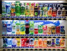 a vending machine filled with lots of different types of drinks and beverages on shelves