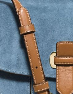 This classic saddle bag messenger comes beautifully crafted in luxurious tonal suede that only gets better with age and looks equally chic with dresses or jeans